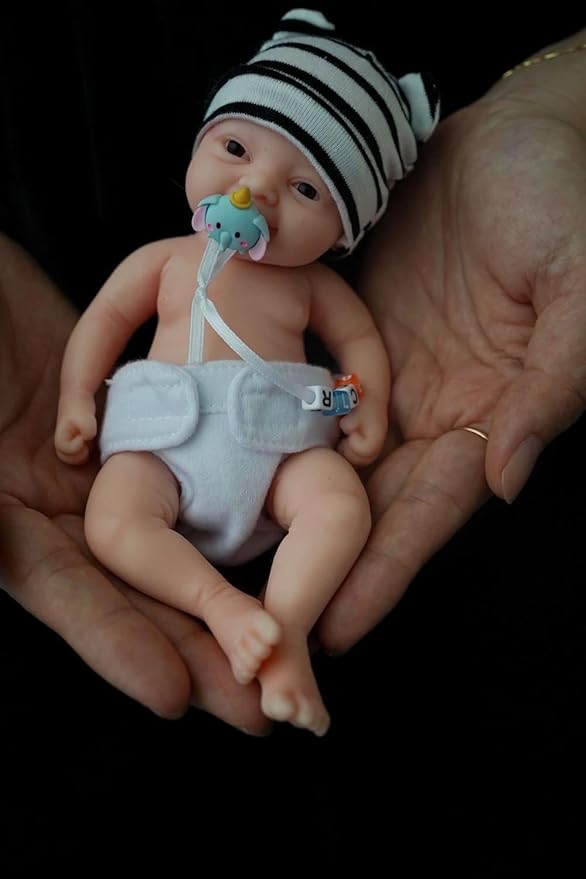 Reborn Baby Doll ，7 Inch Silicone Doll Girl ，Mini Realistic Newborn Baby Dolls Silicone Full Body Stress Relief with Feeding Accessories