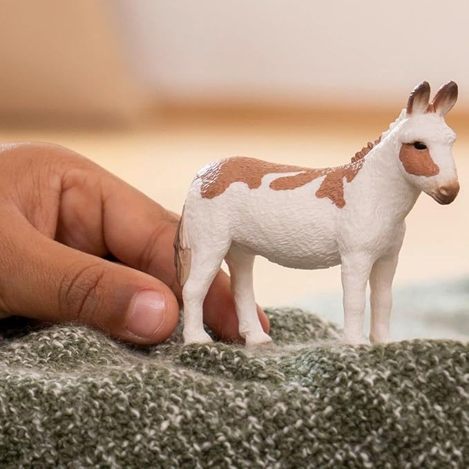 Schleich Farm World American Spotted Donkey Animal Figurine - Highly Detailed and Durable Farm Animal Toy, Fun and Educational Play for Boys and Girls, Gift for Kids Ages 3+, Multicolor, 2.5 inch