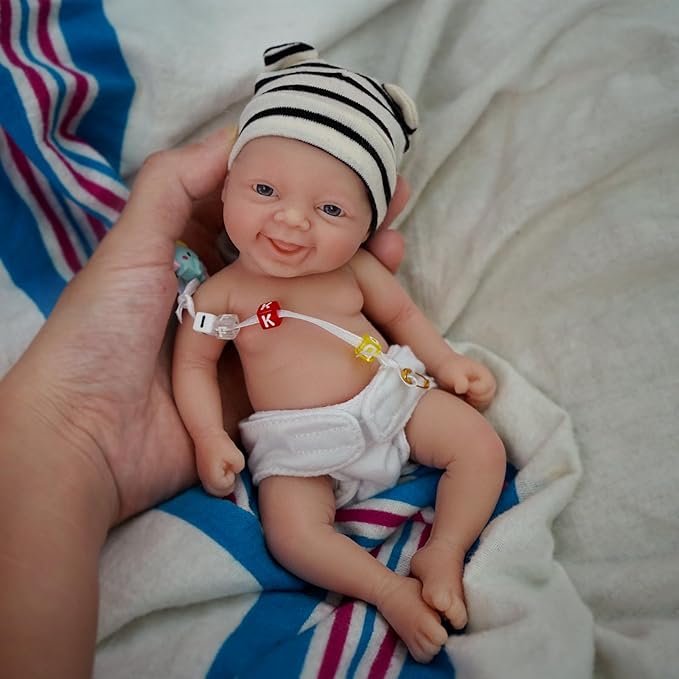 Reborn Baby Doll ，7 Inch Silicone Doll Girl ，Mini Realistic Newborn Baby Dolls Silicone Full Body Stress Relief with Feeding Accessories