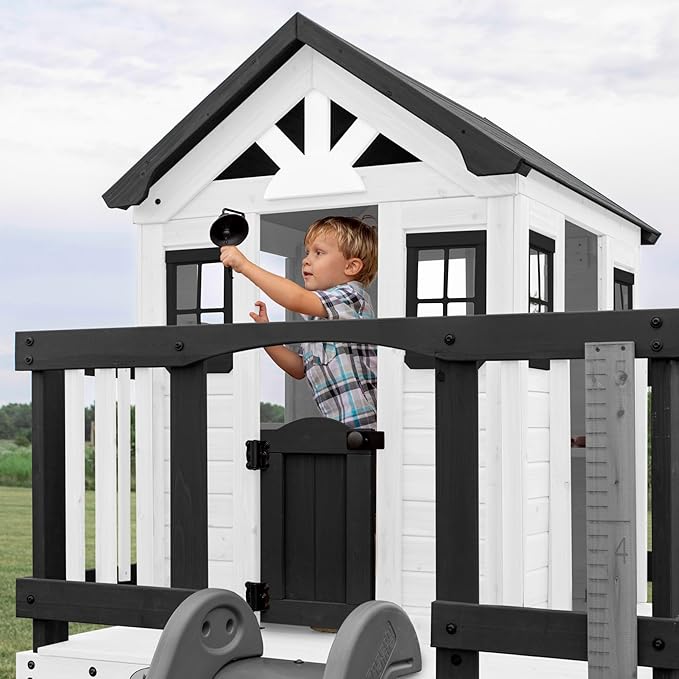 Backyard Discovery Sweetwater Heights White Elevated Cedar Wooden Kids Playhouse with Wave Slide, Play Kitchen, Step Ladder, Half Door, Wrap-Around Deck, Windows, Bell, Growth Chart for Outdoor Play