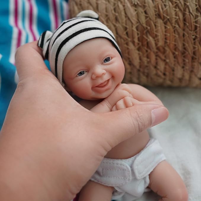 Reborn Baby Doll ，7 Inch Silicone Doll Girl ，Mini Realistic Newborn Baby Dolls Silicone Full Body Stress Relief with Feeding Accessories