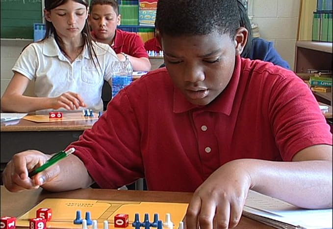 Hands-On Equations® Class Set for Teacher and 20 Students. Includes The Teacher Demonstration Balance Scale & Game Pieces and 20 Sets of Student manipulatives. Grade 3 and up.