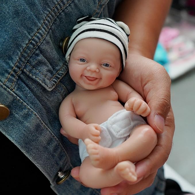 Reborn Baby Doll ，7 Inch Silicone Doll Girl ，Mini Realistic Newborn Baby Dolls Silicone Full Body Stress Relief with Feeding Accessories
