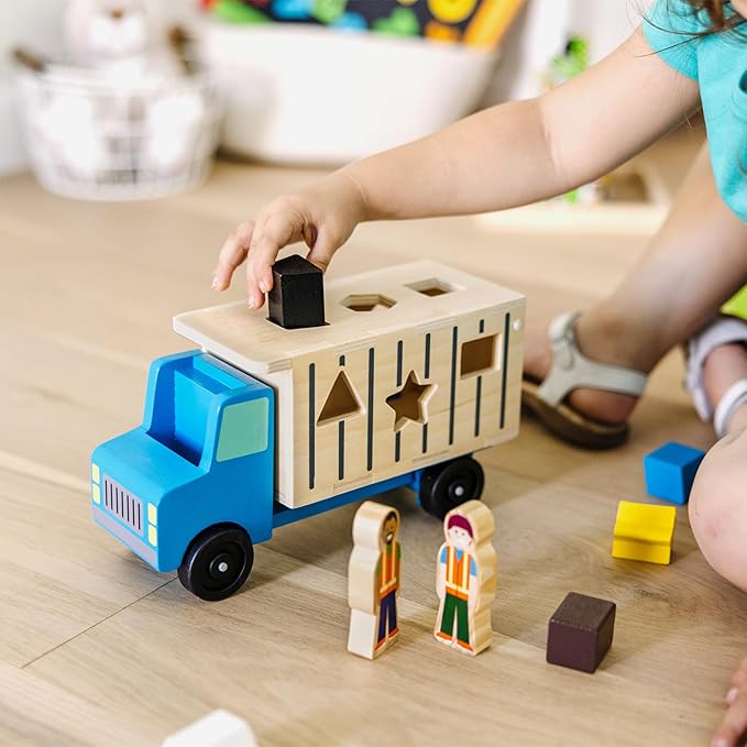 Melissa & Doug Shape-Sorting Wooden Dump Truck Toy with 9 Colorful Shapes and 2 Play Figures Wooden Vehicle Toys, Shape Sorter Toys for Toddlers Ages 2+