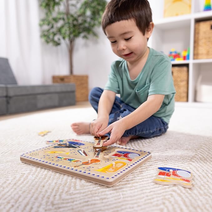 Melissa & Doug Musical Instruments Sound Puzzle - Wooden Peg Puzzle with Light-Activated Sound Effects (8 pcs) Wooden Peg Baby Music Learning Toys, for Toddlers and Preschoolers Ages 2+