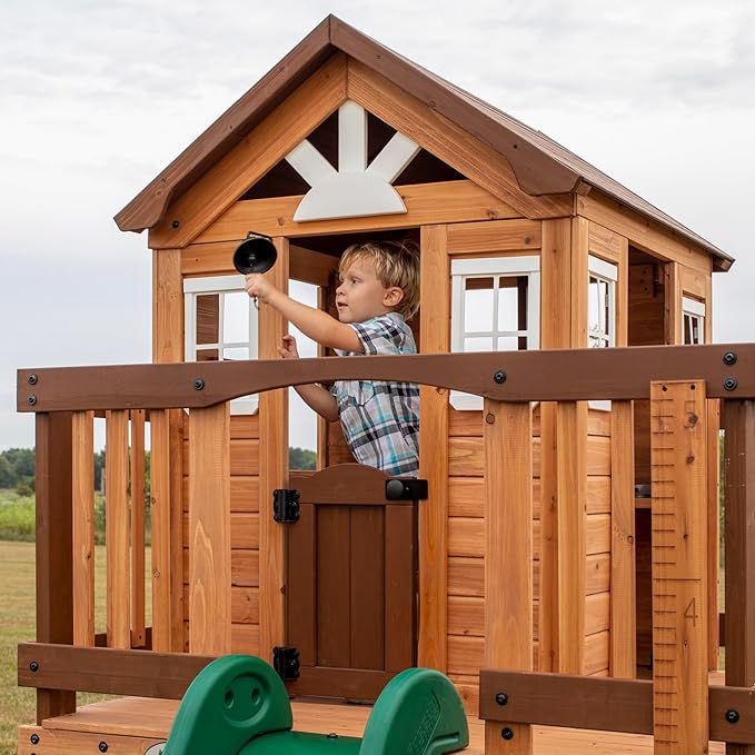 Backyard Discovery Echo Heights Elevated Cedar Wooden Kids Playhouse with Wave Slide, Play Kitchen, Wrap-Around Deck, Flat-Step Ladder, Half Door, Windows, Bell, and Growth Chart for Outdoor Play