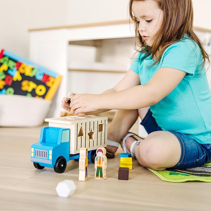 Melissa & Doug Shape-Sorting Wooden Dump Truck Toy with 9 Colorful Shapes and 2 Play Figures Wooden Vehicle Toys, Shape Sorter Toys for Toddlers Ages 2+