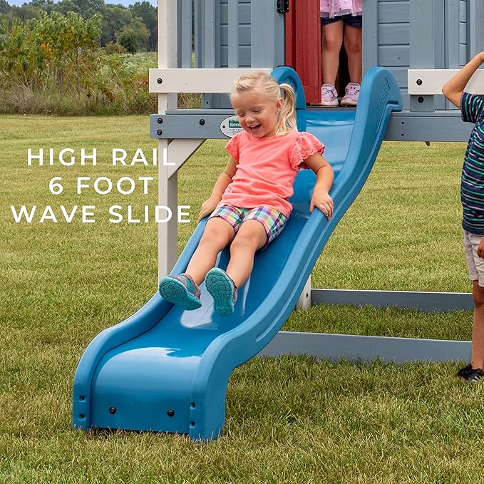 Backyard Discovery Beacon Heights Elevated Cedar Wooden Kids Playhouse with Wave Slide, Play Kitchen, Wrap-Around Deck, Flat-Step Ladder, Half Door, Windows, Bell, and Growth Chart for Outdoor Play