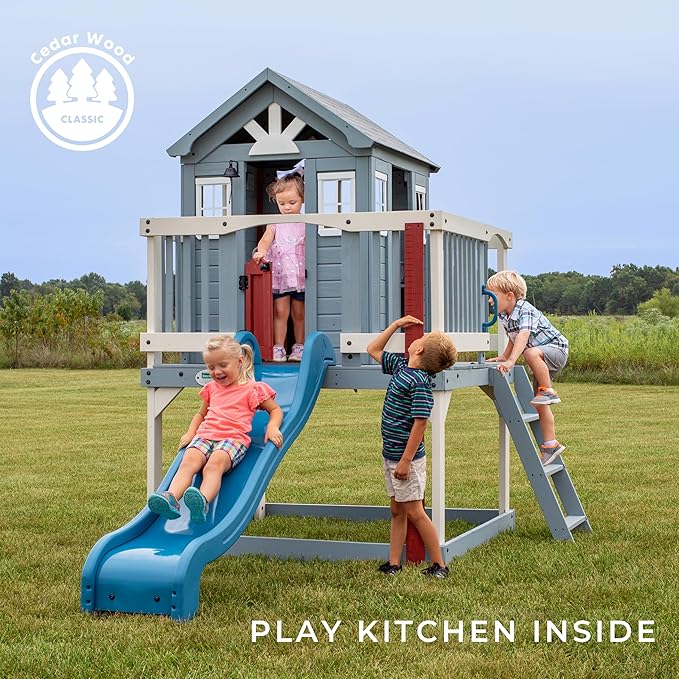 Backyard Discovery Beacon Heights Elevated Cedar Wooden Kids Playhouse with Wave Slide, Play Kitchen, Wrap-Around Deck, Flat-Step Ladder, Half Door, Windows, Bell, and Growth Chart for Outdoor Play