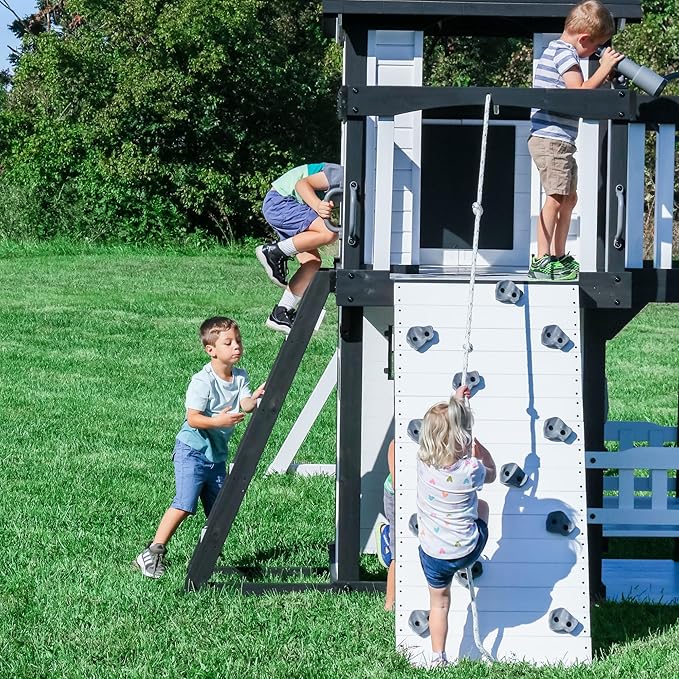 Backyard Discovery Canyon Creek White Cedar Wood Swing Set with Wave Slide, Clubhouse, Play Kitchen, Picnic Area, Belt Swings, Web Swing, Rock Wall, Balconies, Playhouse, Step Ladder, Outdoor Playset