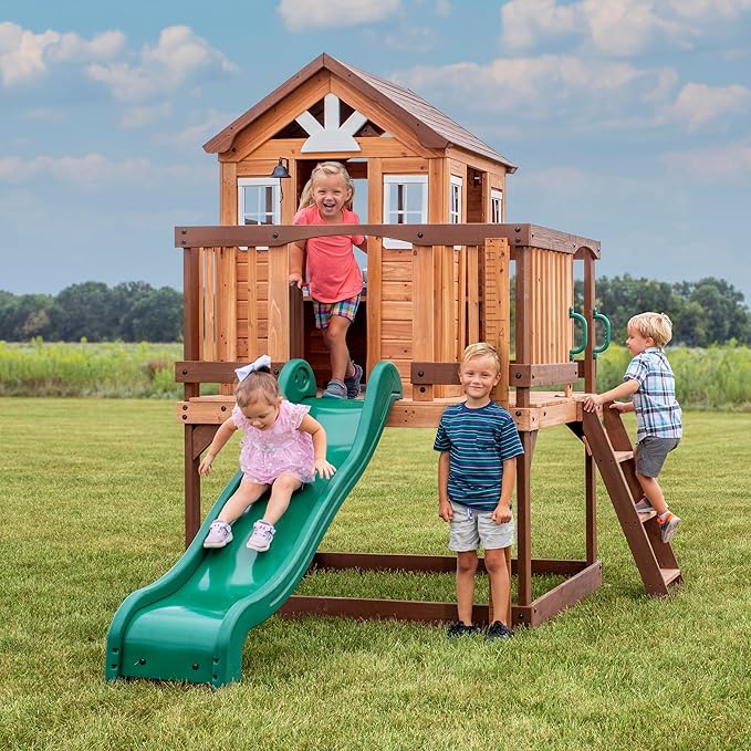 Backyard Discovery Echo Heights Elevated Cedar Wooden Kids Playhouse with Wave Slide, Play Kitchen, Wrap-Around Deck, Flat-Step Ladder, Half Door, Windows, Bell, and Growth Chart for Outdoor Play
