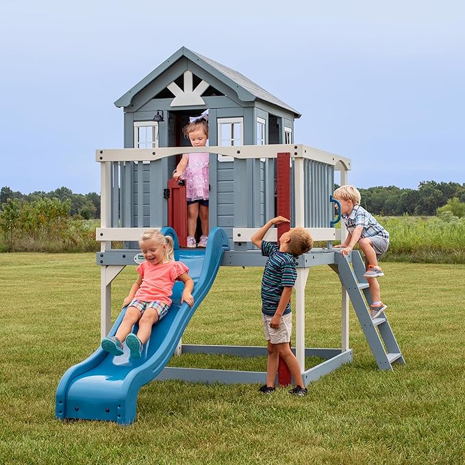 Backyard Discovery Beacon Heights Elevated Cedar Wooden Kids Playhouse with Wave Slide, Play Kitchen, Wrap-Around Deck, Flat-Step Ladder, Half Door, Windows, Bell, and Growth Chart for Outdoor Play