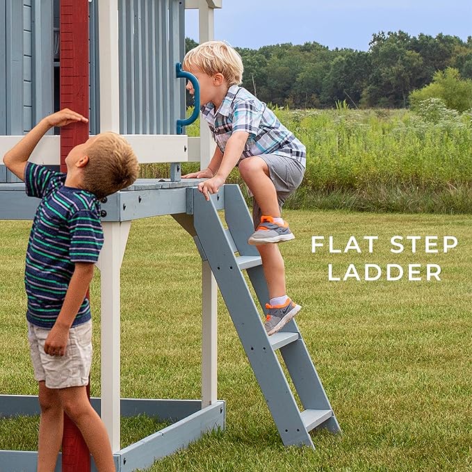 Backyard Discovery Beacon Heights Elevated Cedar Wooden Kids Playhouse with Wave Slide, Play Kitchen, Wrap-Around Deck, Flat-Step Ladder, Half Door, Windows, Bell, and Growth Chart for Outdoor Play